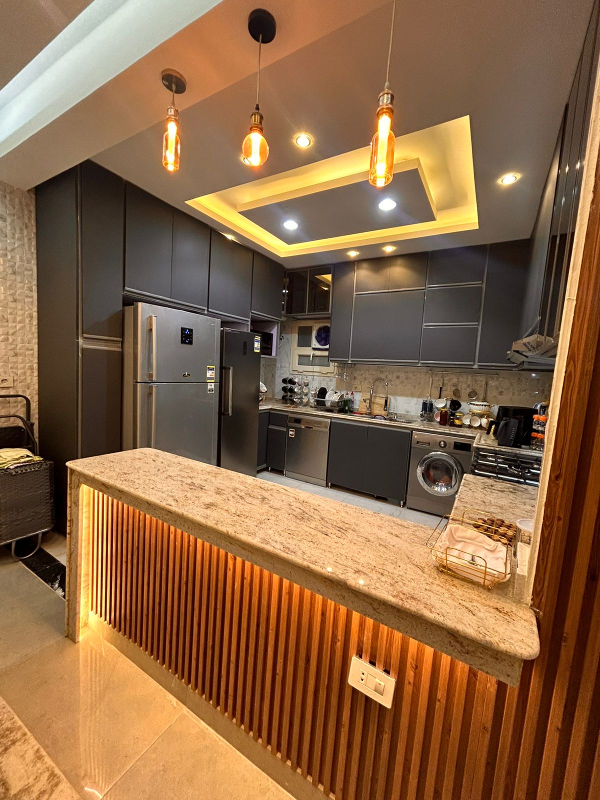 Aluminum kitchen upper cabinets installed at a comfortable height in a Kitchen Munir design